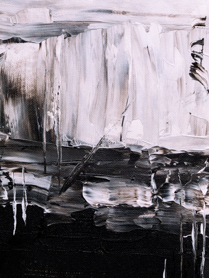 services-03 Bold and expressive abstract painting in monochrome tones with fluid patterns.